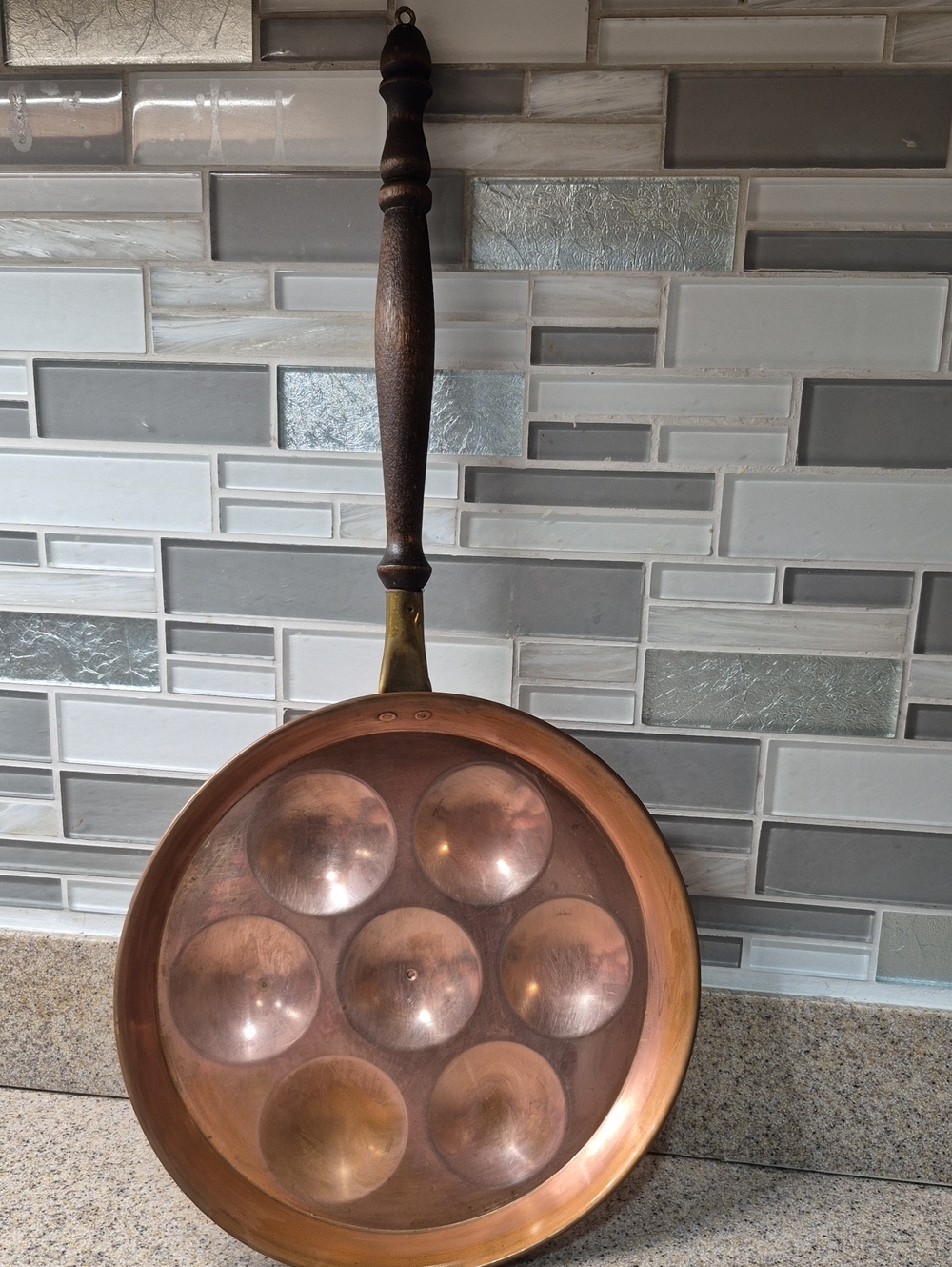 Beautiful vintage solid copper 7-cup pan featuring a classic turned wood handle.